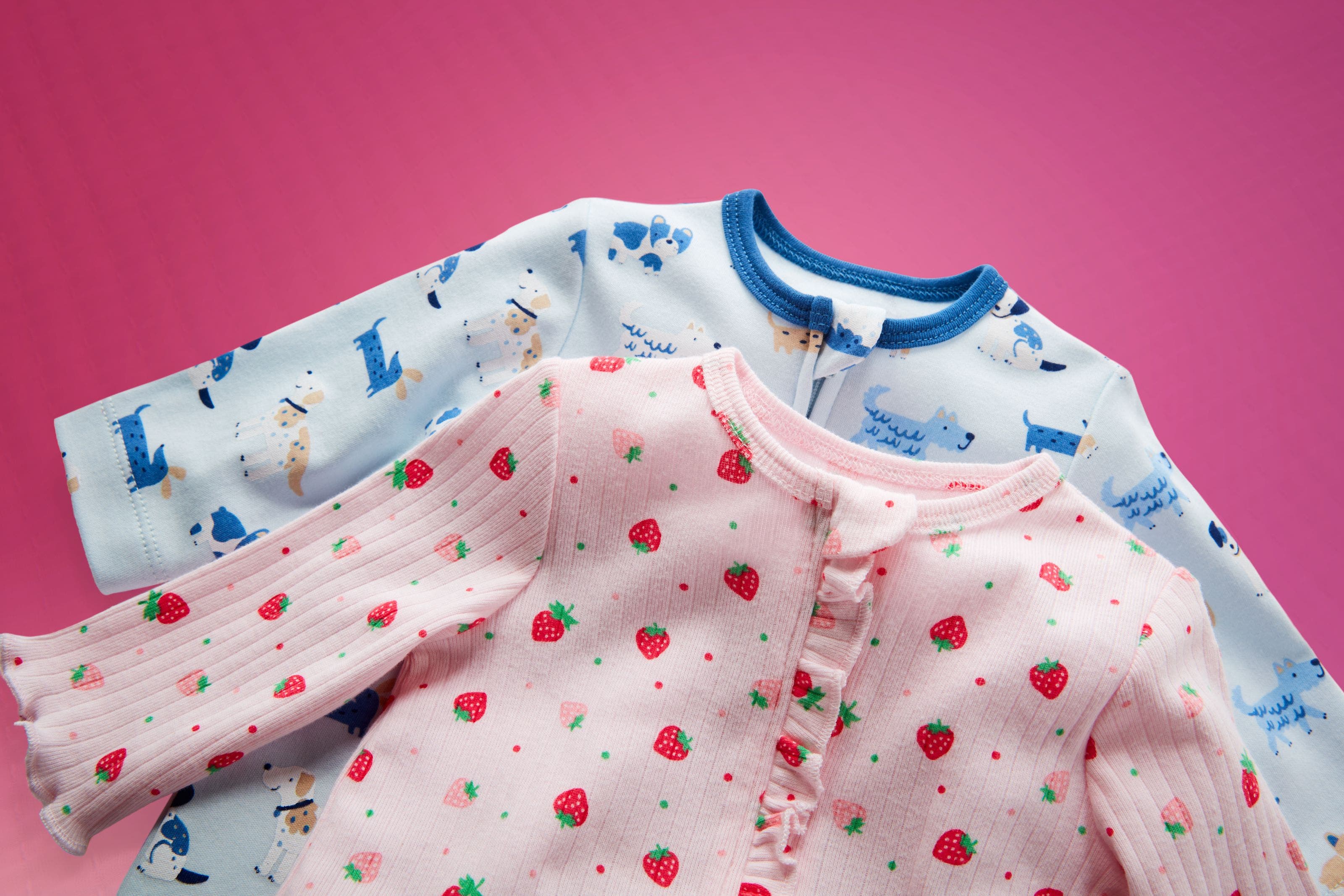 A pair of printed onesies.