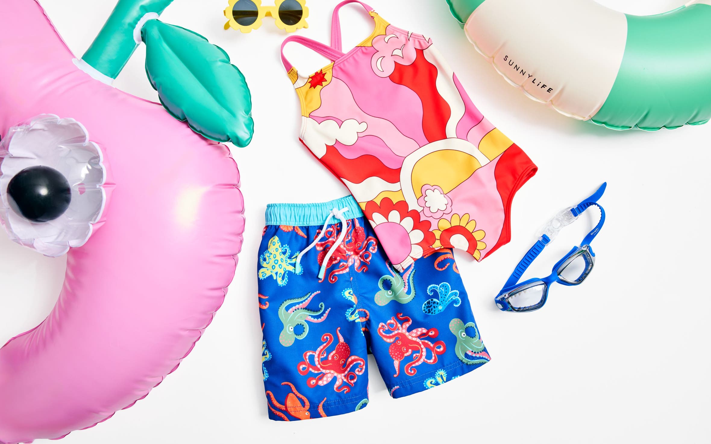 A collection of swimwear, accessories and toys for kids.