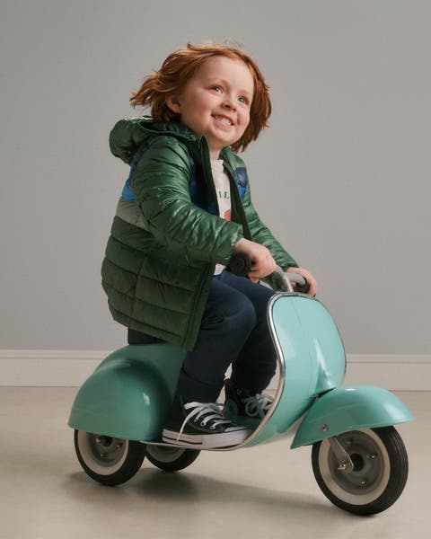 a boy riding a bike.