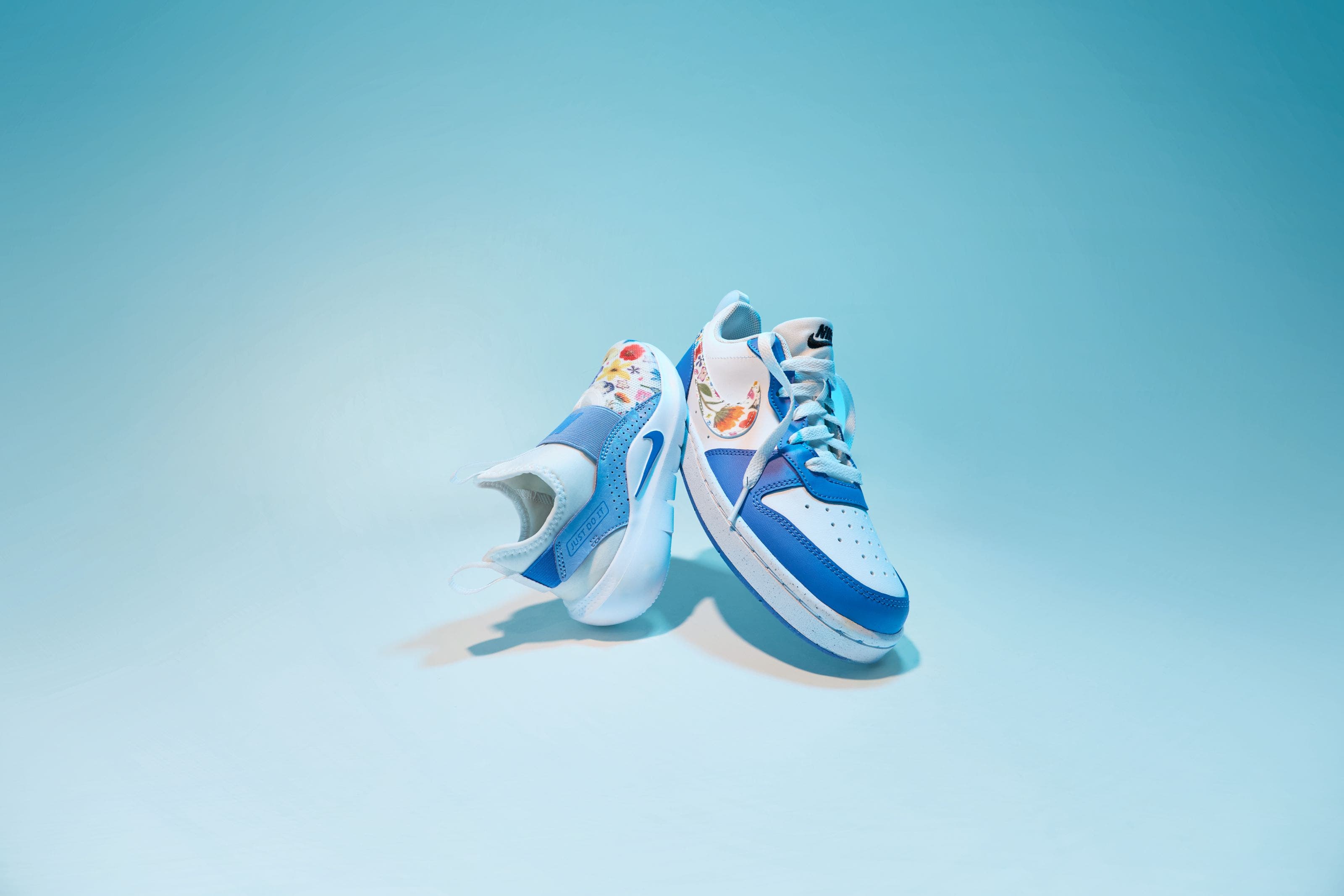 Image of two kids Nike sneakers. 