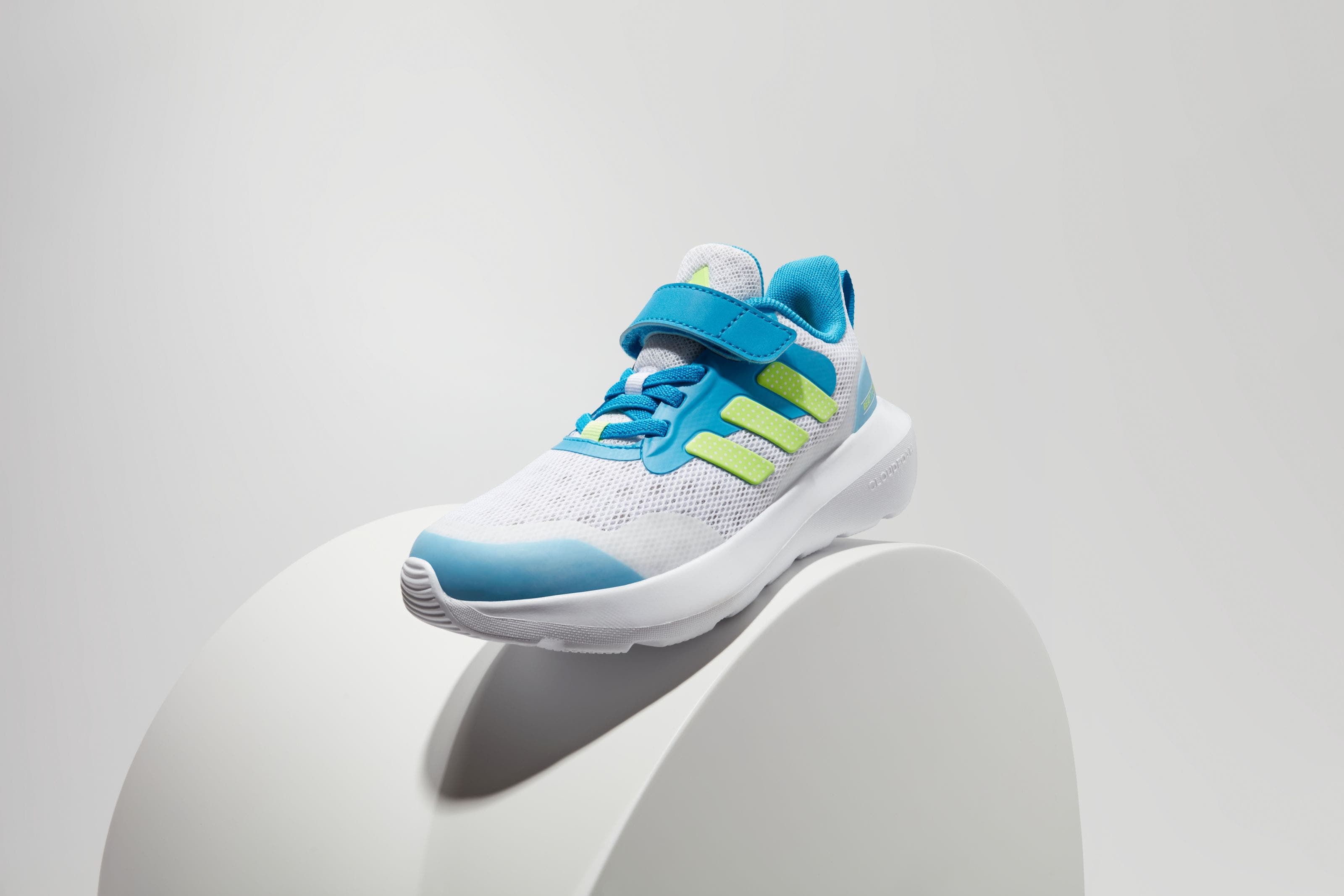 A boys’ blue, green and white sneaker.