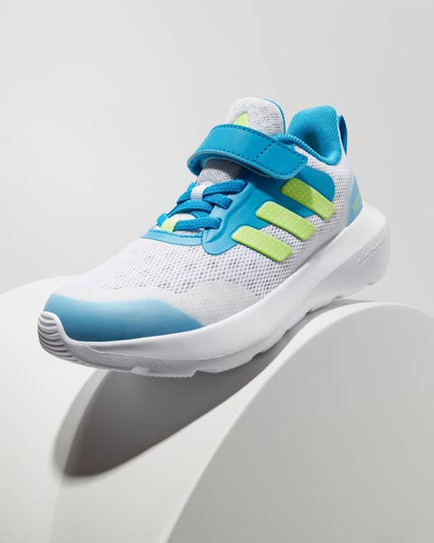 A boys’ blue, green and white sneaker.