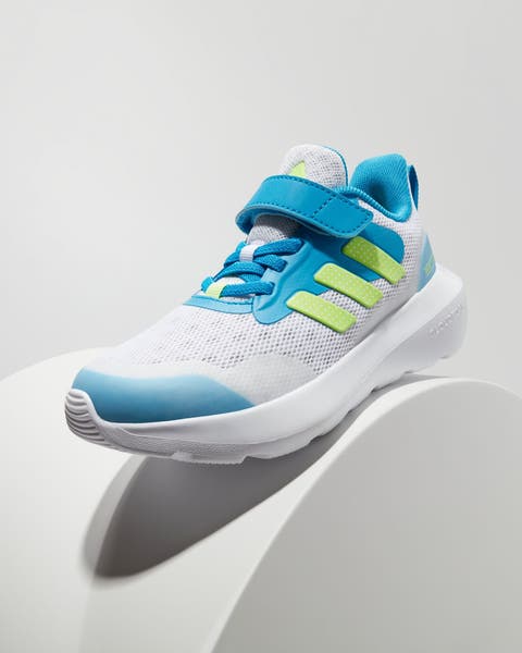 A boys’ blue, green and white sneaker.