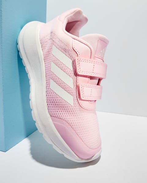 A girls’ pink adidas sneaker.