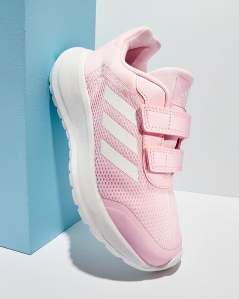 A girls’ pink adidas sneaker.