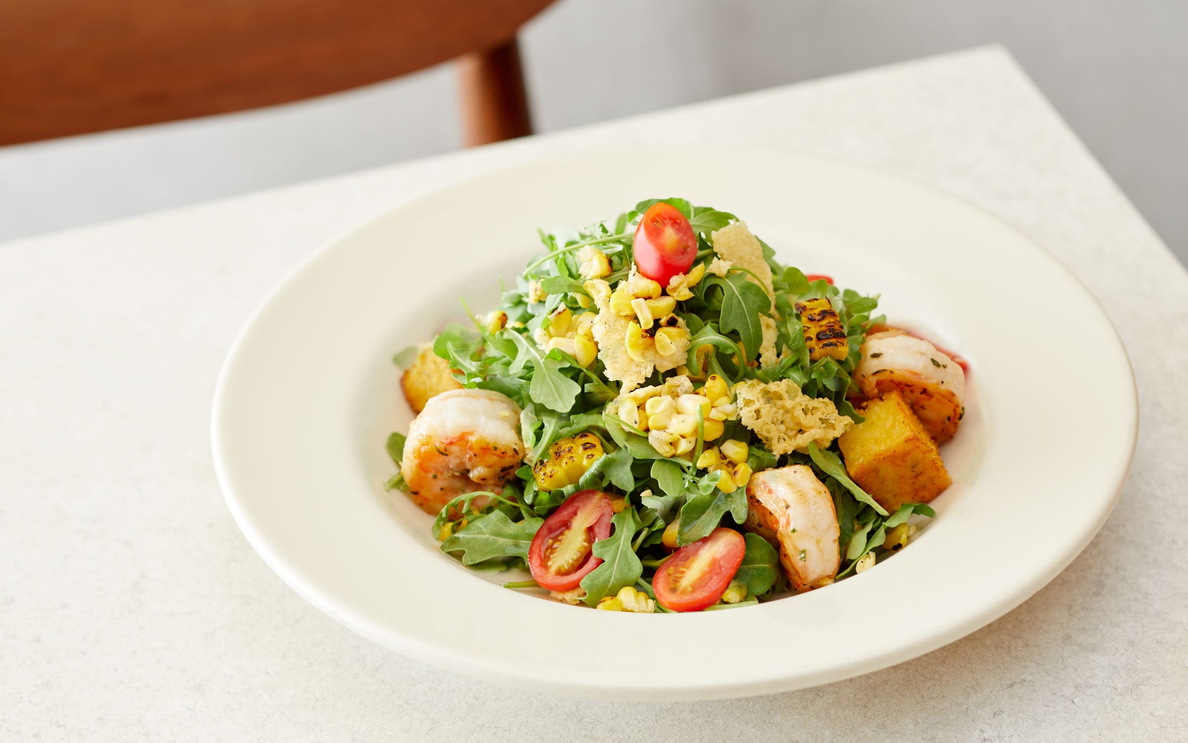 A Nordstrom salad with grilled shrimp.