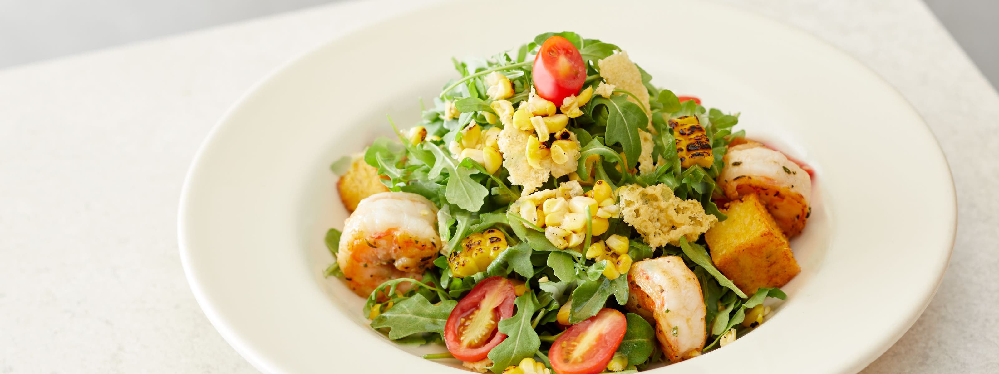 A Nordstrom salad with grilled shrimp.