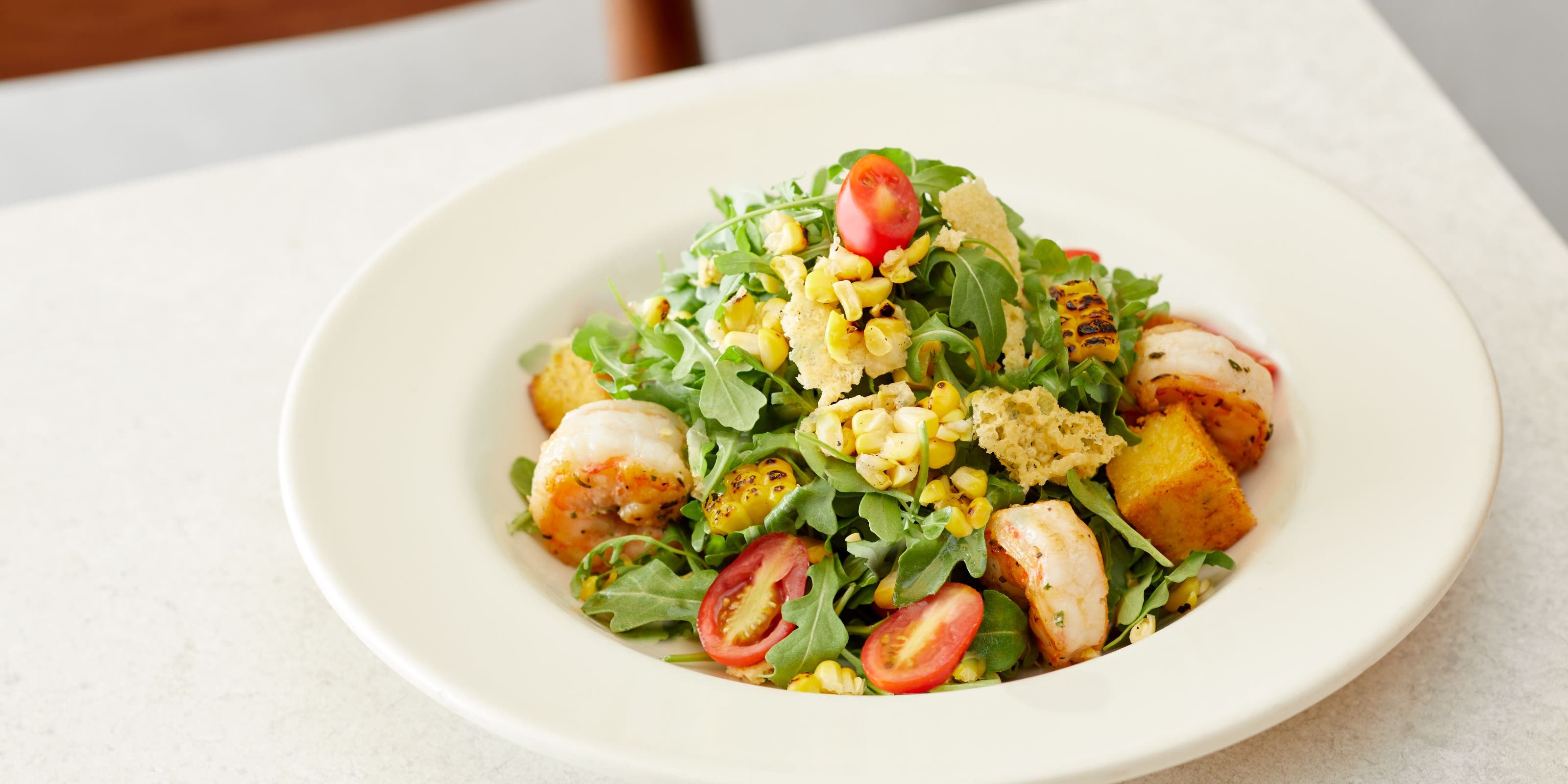 A Nordstrom salad with grilled shrimp.