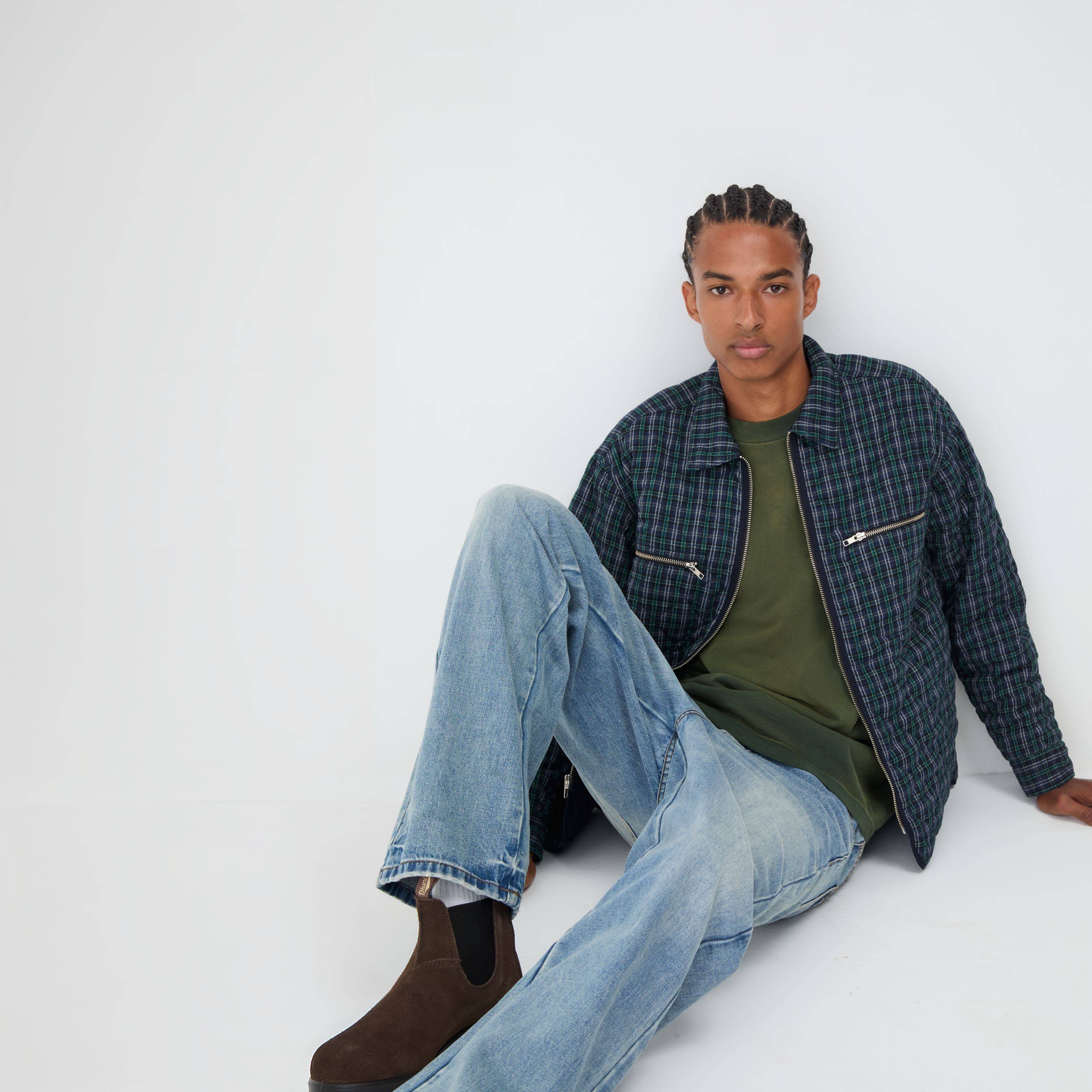 Aman wearing jeans, tee shirt and jacket.