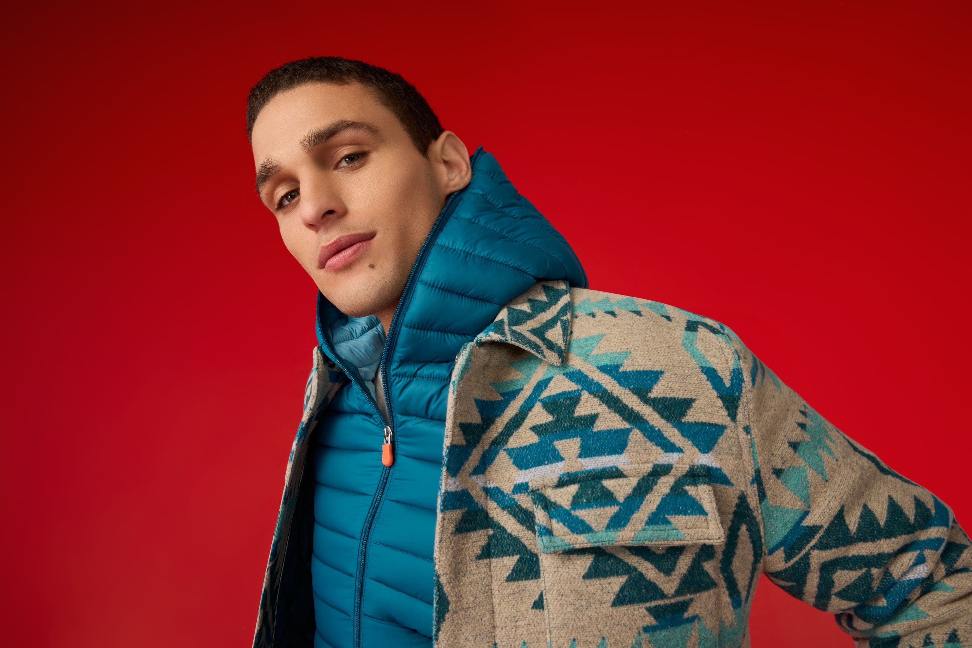 A man wearing a puffer jacket. 