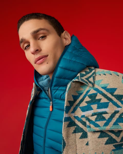 A man wearing a puffer jacket.