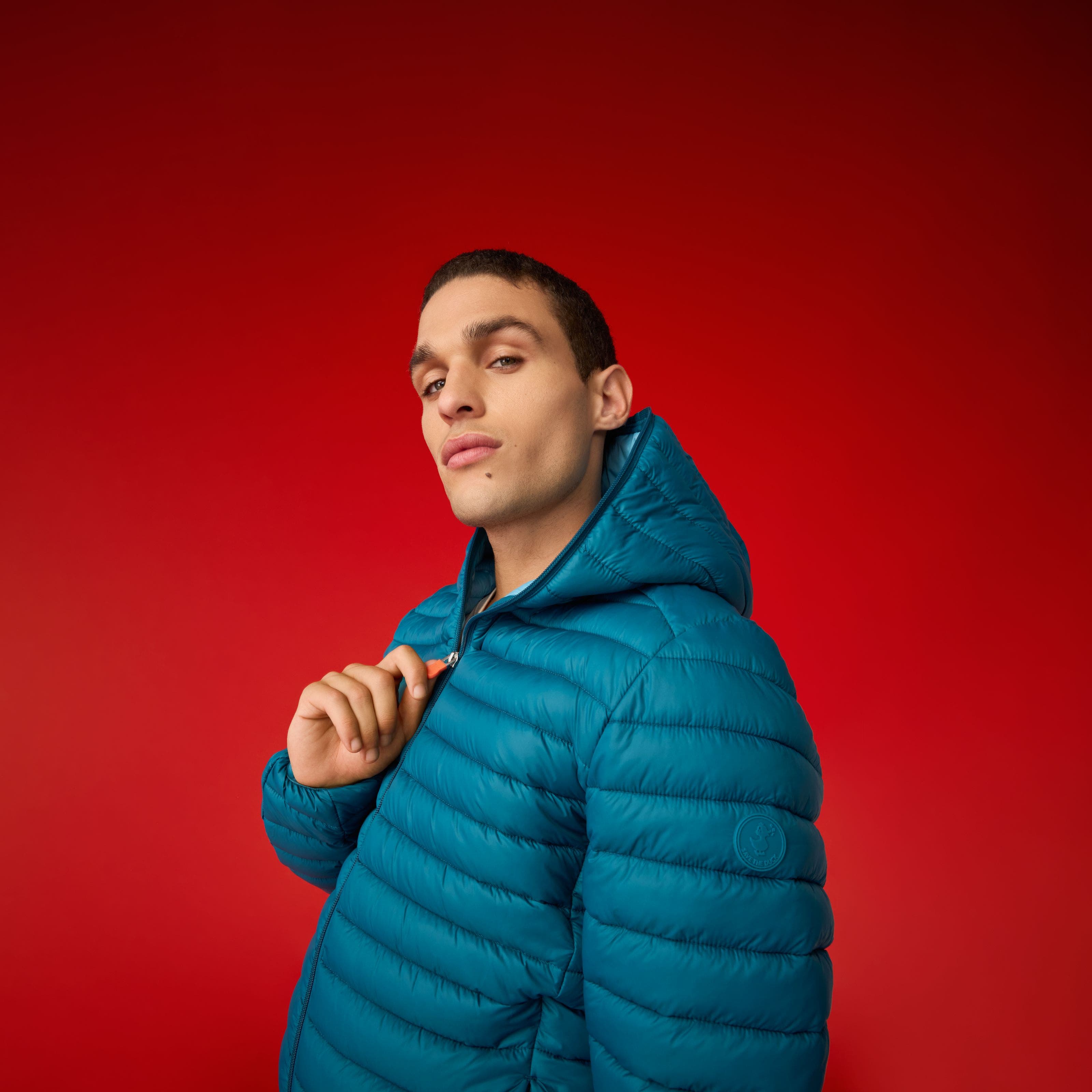 A man wearing a puffer jacket.