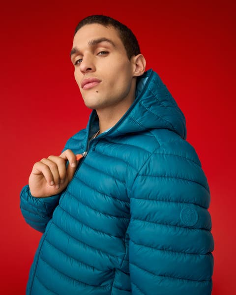 A man wearing a puffer jacket.