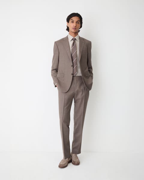 A man wearing brown suit.