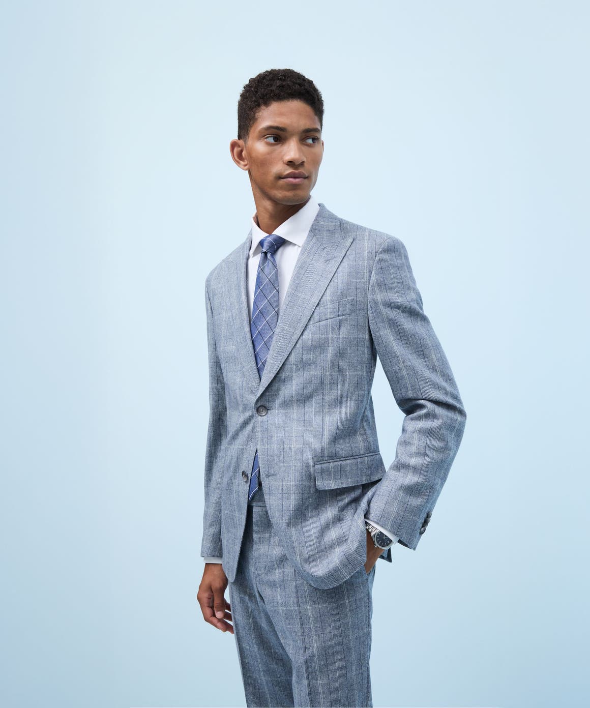 Man wearing a grey suit.