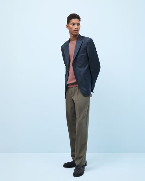 A man wearing a navy blazer.