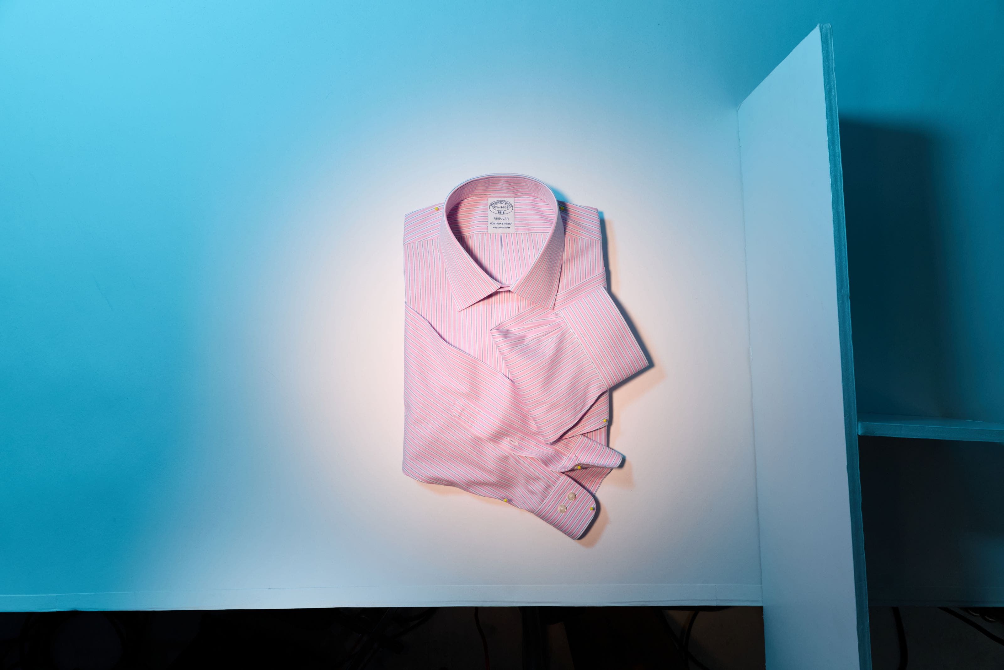A pink folded men's dress shirt.