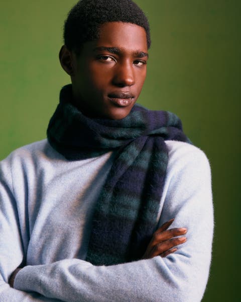 A man wearing a plaid scarf.