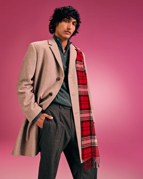 Man in a peacoat.