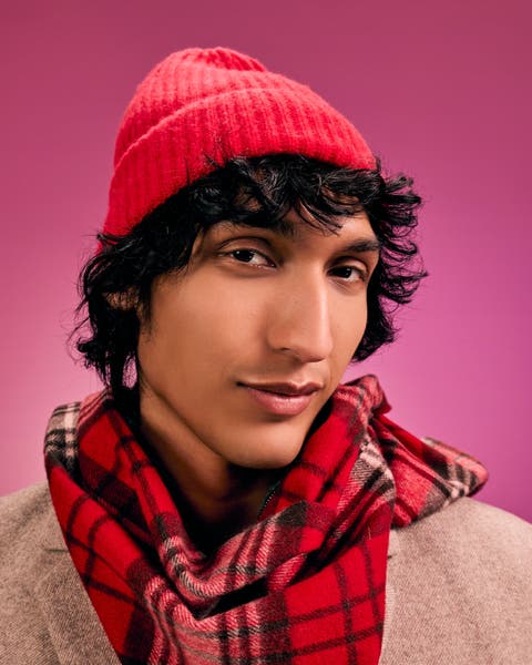 Man wearing hat and scarf.