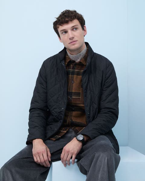 A man wearing a quilted jacket.