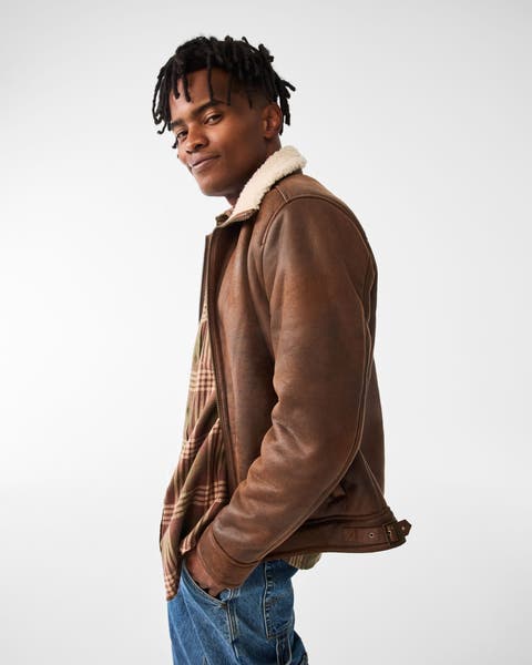 A man wearing a leather jacket. 