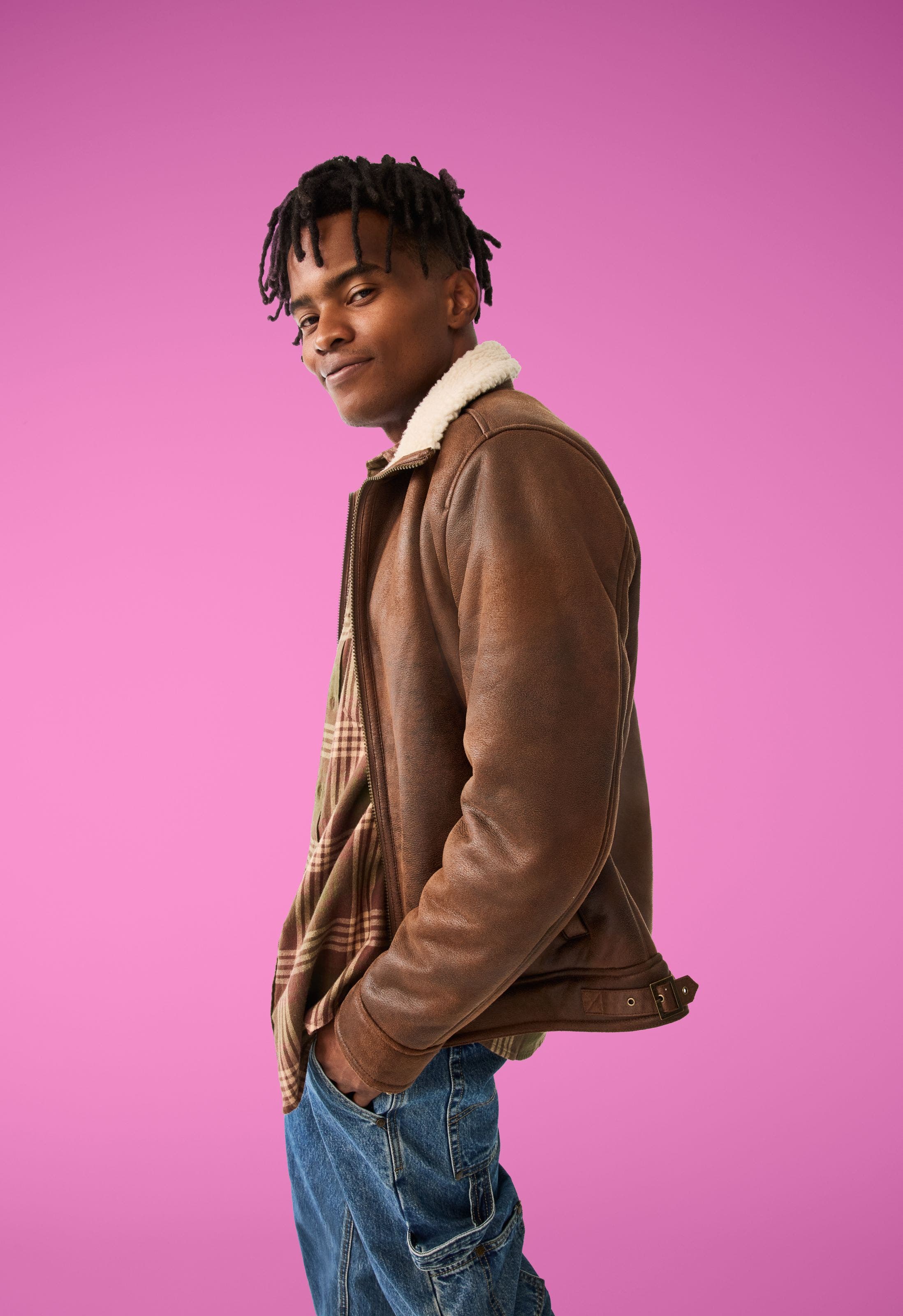 A man wearing a leather jacket. 