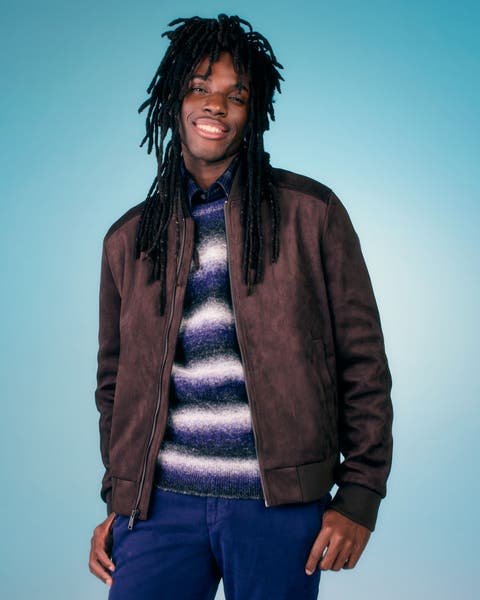A man wearing a leather jacket.