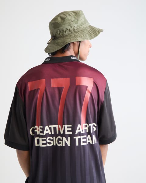 Man wearing SANTO STUDIO jersey.