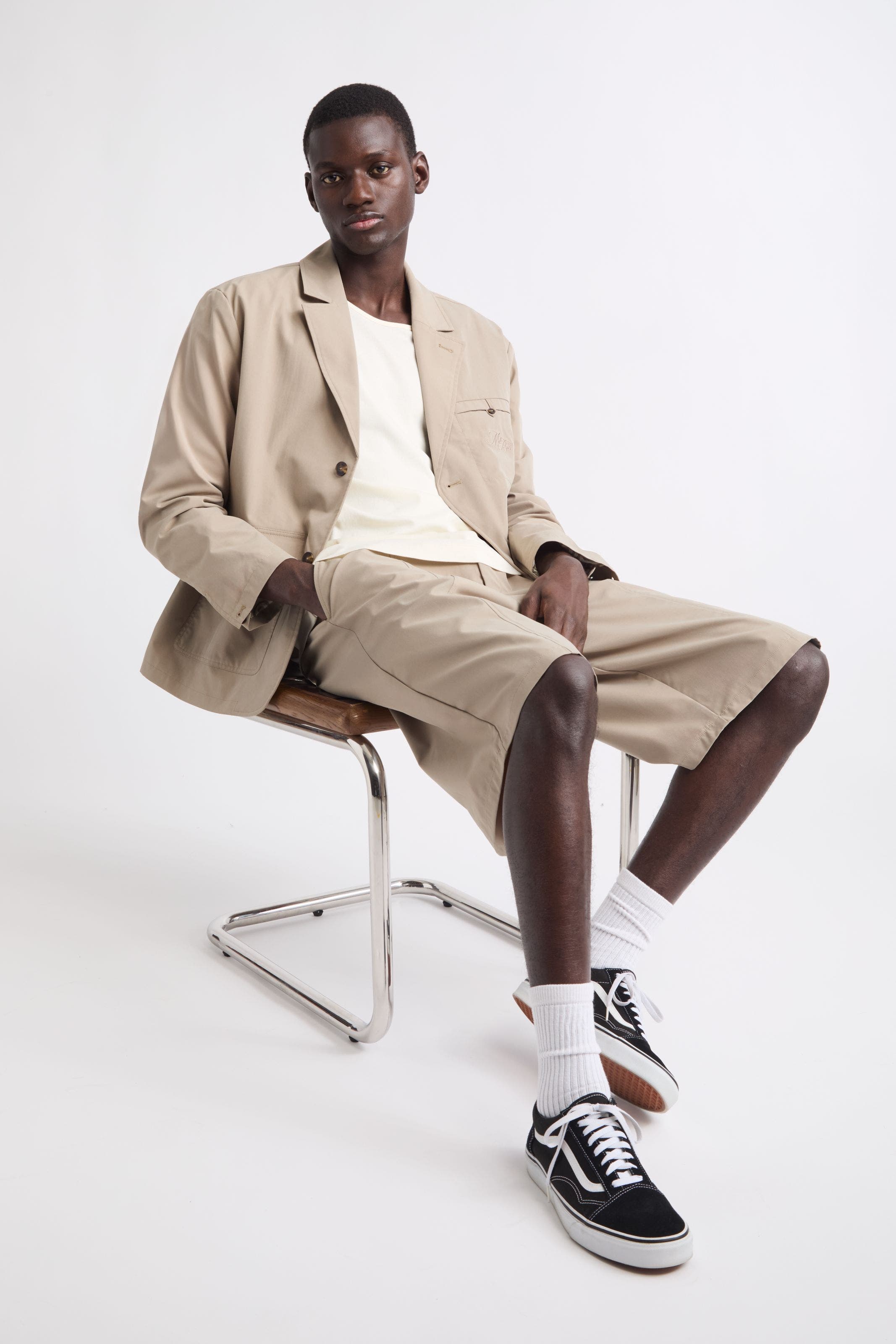 Man wearing Malbon blazer and shorts