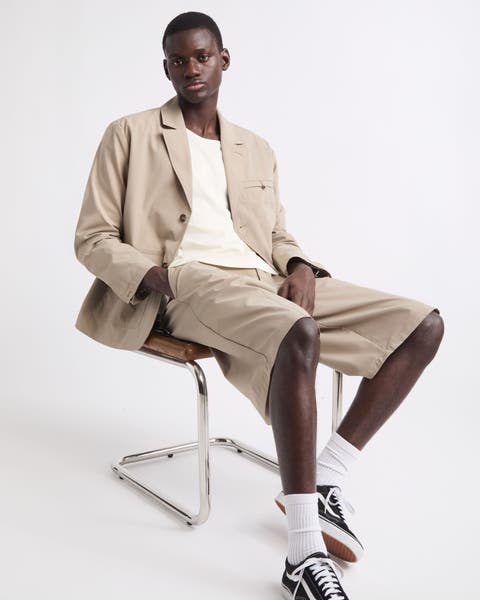 Man wearing Malbon blazer and shorts