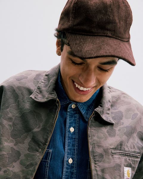 Man wearing a Barbour cap.