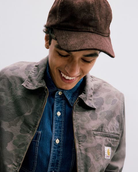 A man wearing a baseball cap.