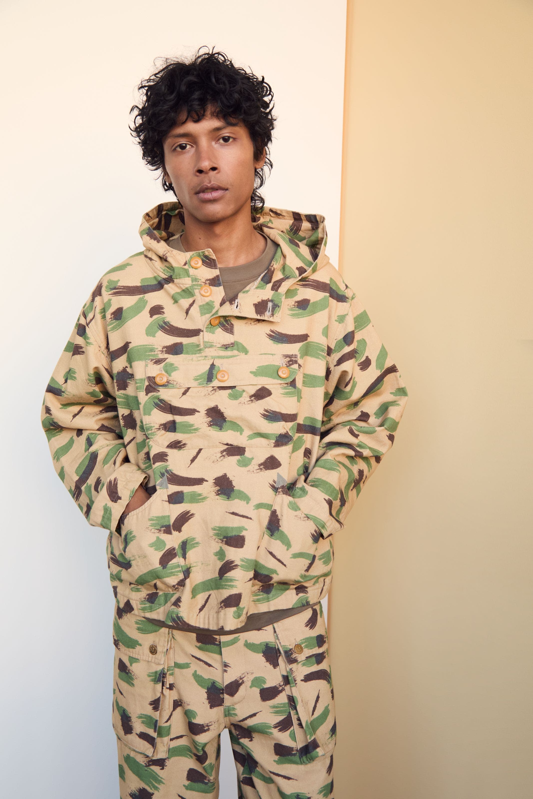 Man wearing Brain Dead camo anorak and pants.
