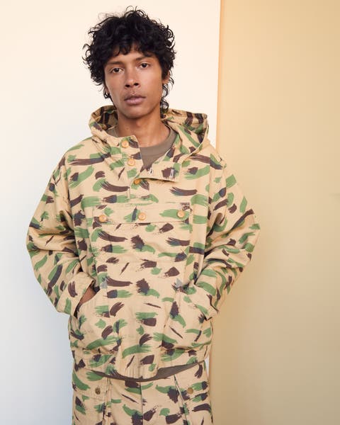 Man wearing Brain Dead camo anorak and pants.