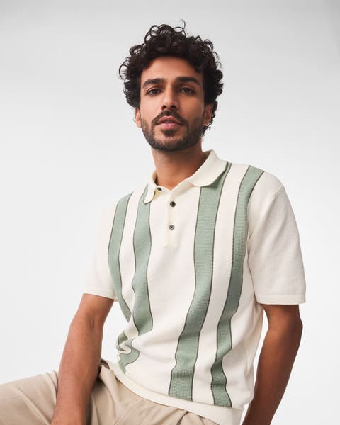 A man wearing a striped polo.