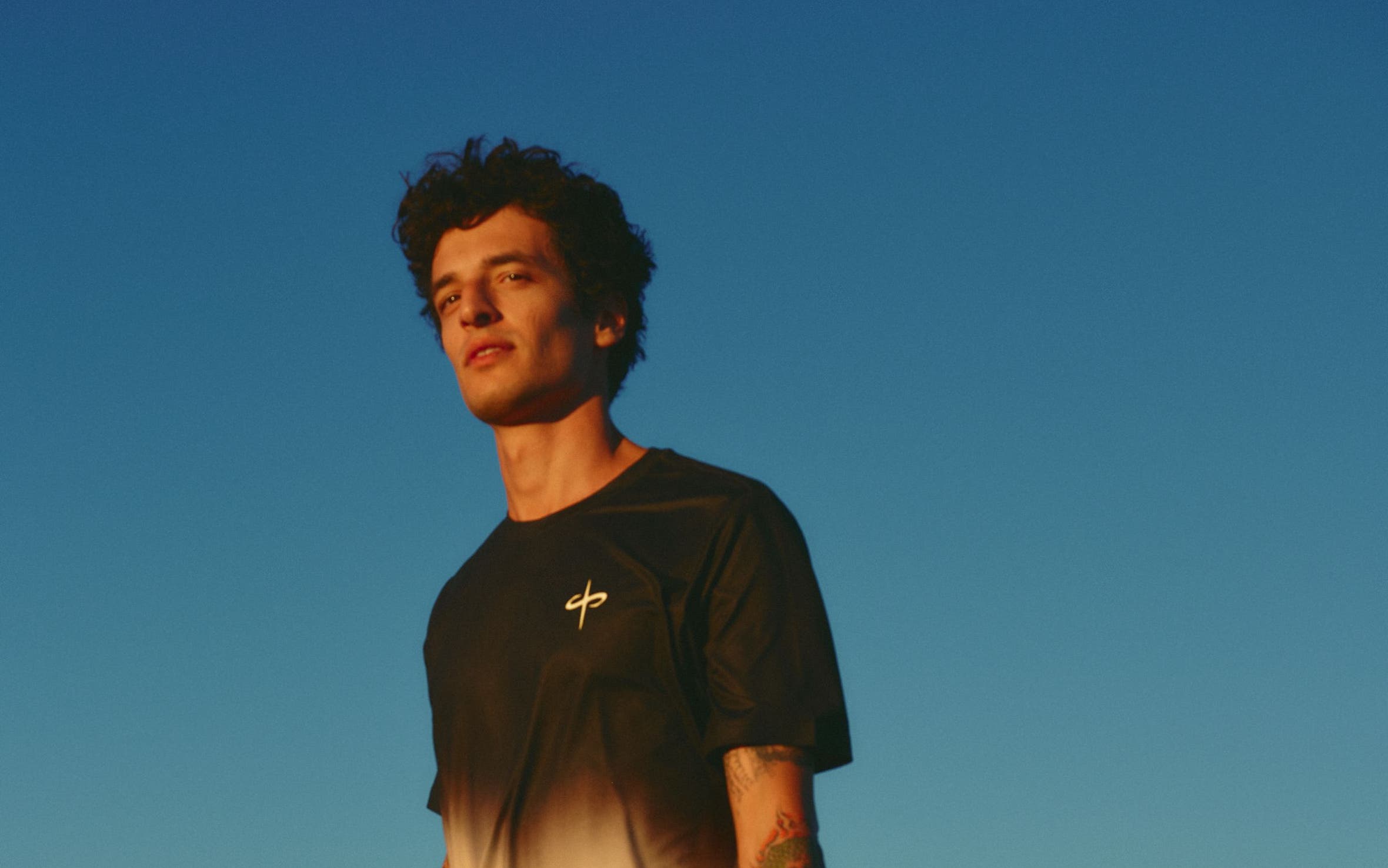 Man wearing a performance tee and shorts.