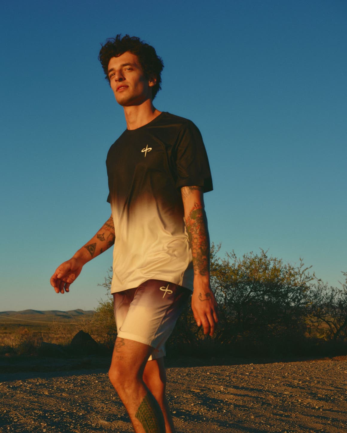 Man wearing a performance tee and shorts.