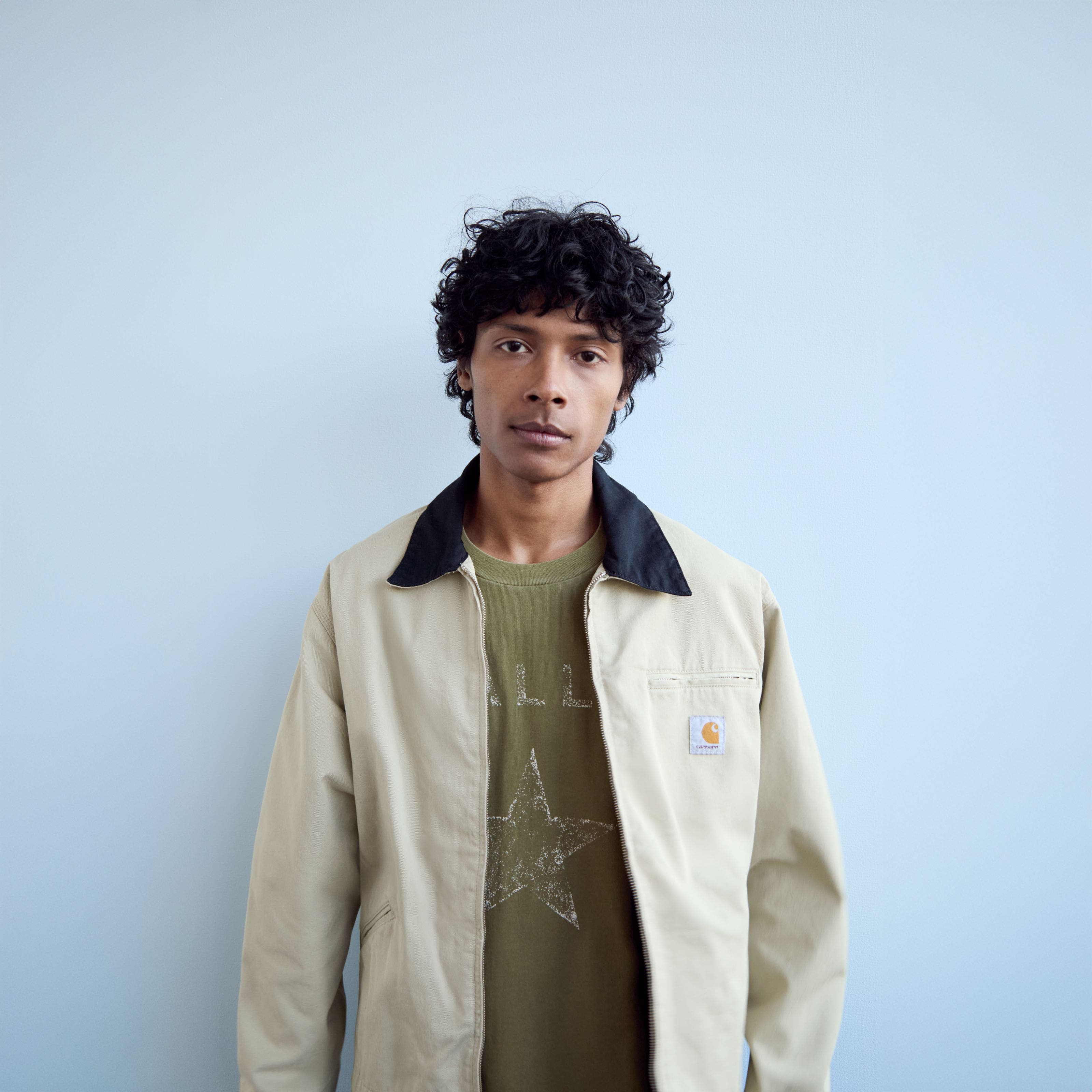 A man wearing a utility jacket.