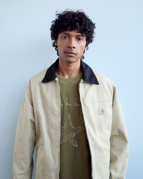 A man wearing a utility jacket.