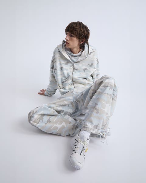 A man wearing tonal Elwood camo set.