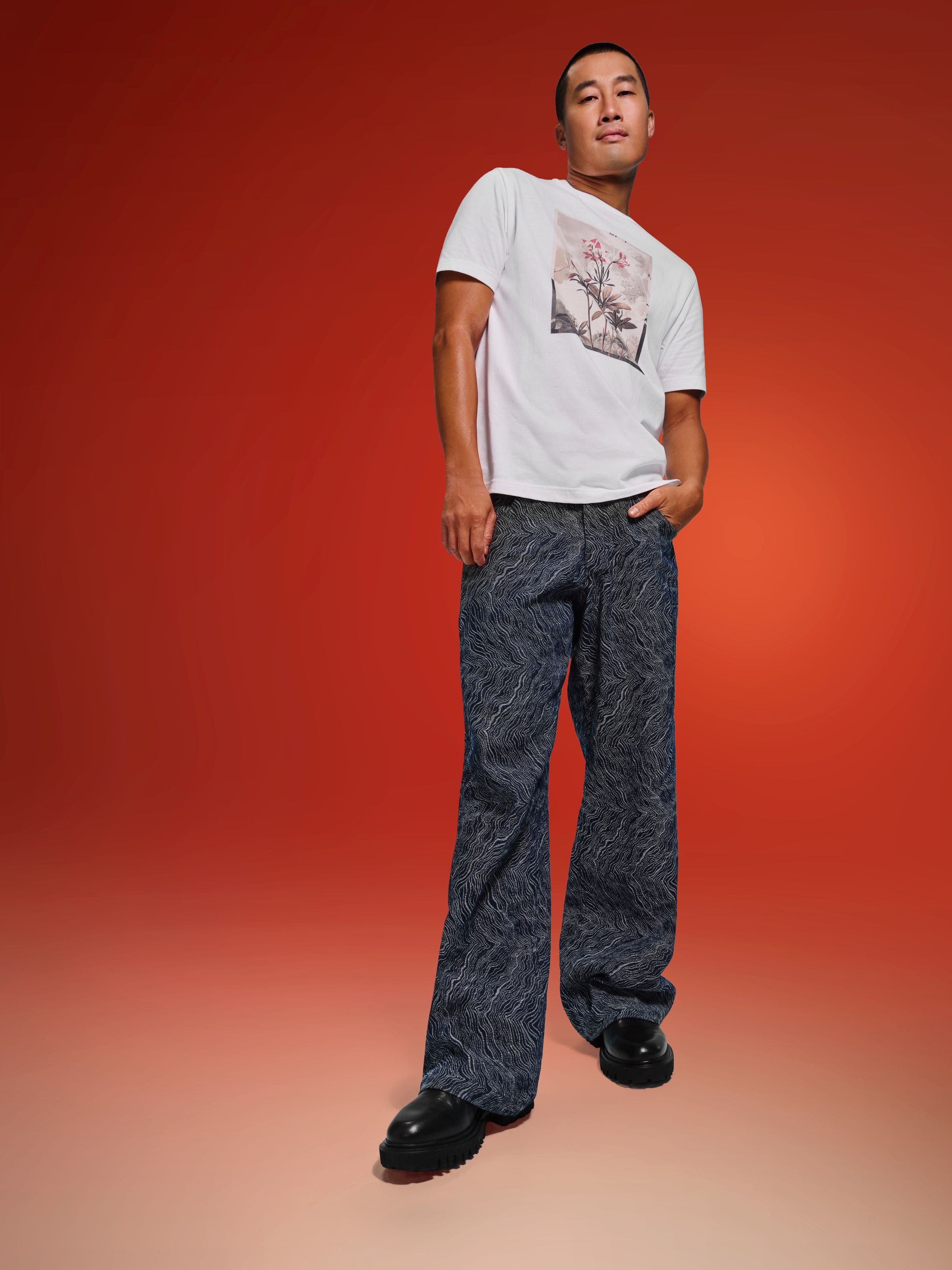 A man in a t-shirt and jeans.