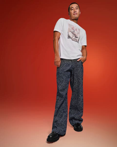 A man in a t-shirt and jeans.