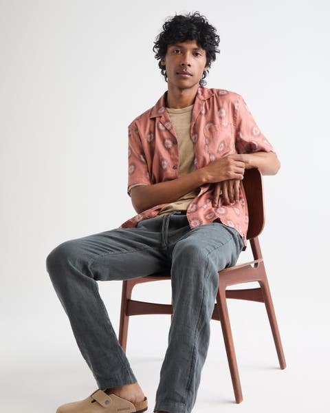 Man wearing a Faherty button-up, chinos and Birkenstock Bostons.