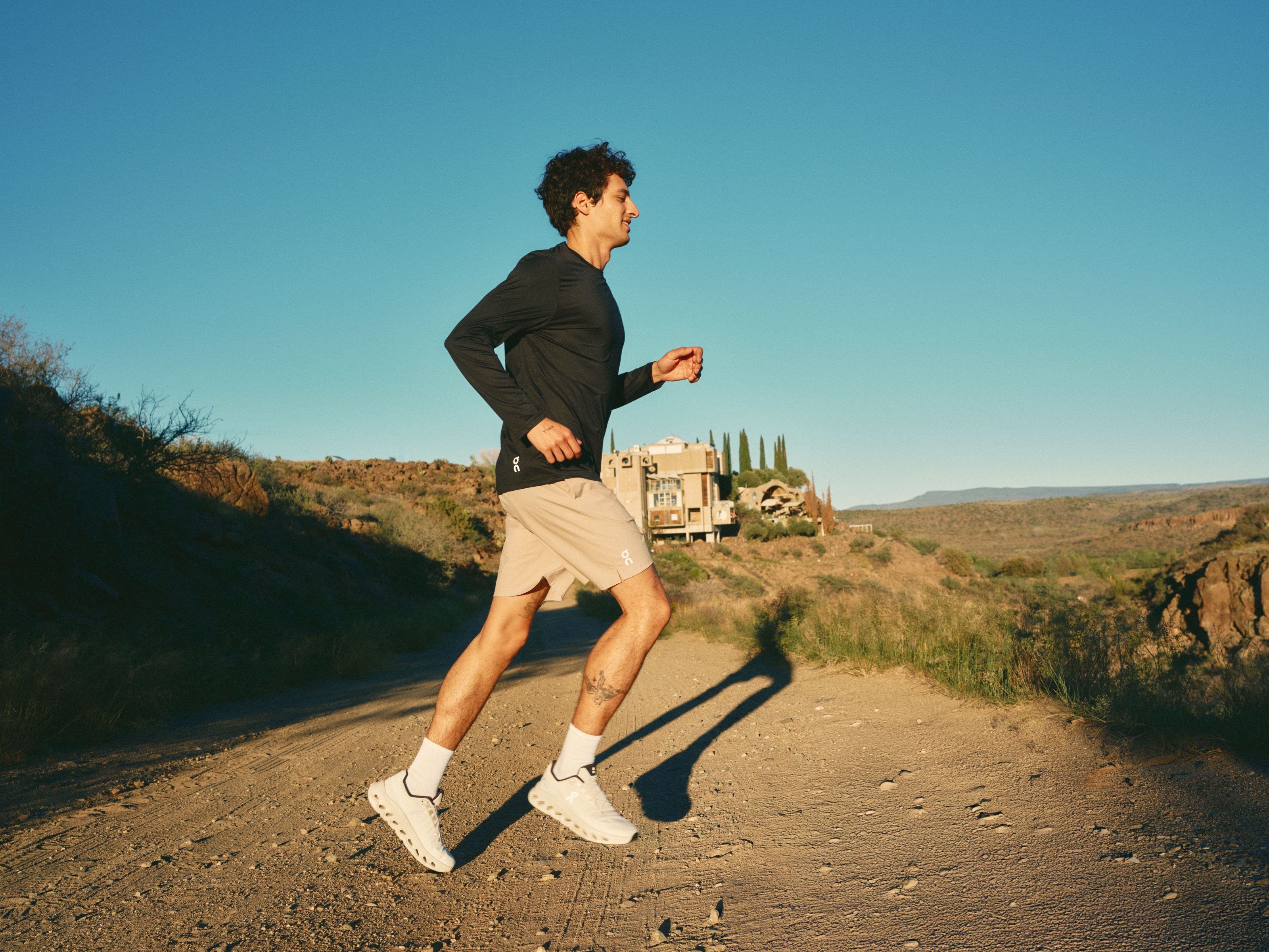 Man wearing On activewear and sneakers.