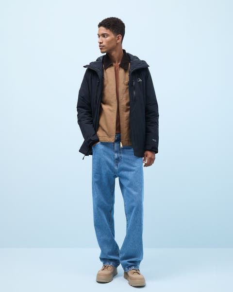 A man wearing relaxed jeans.