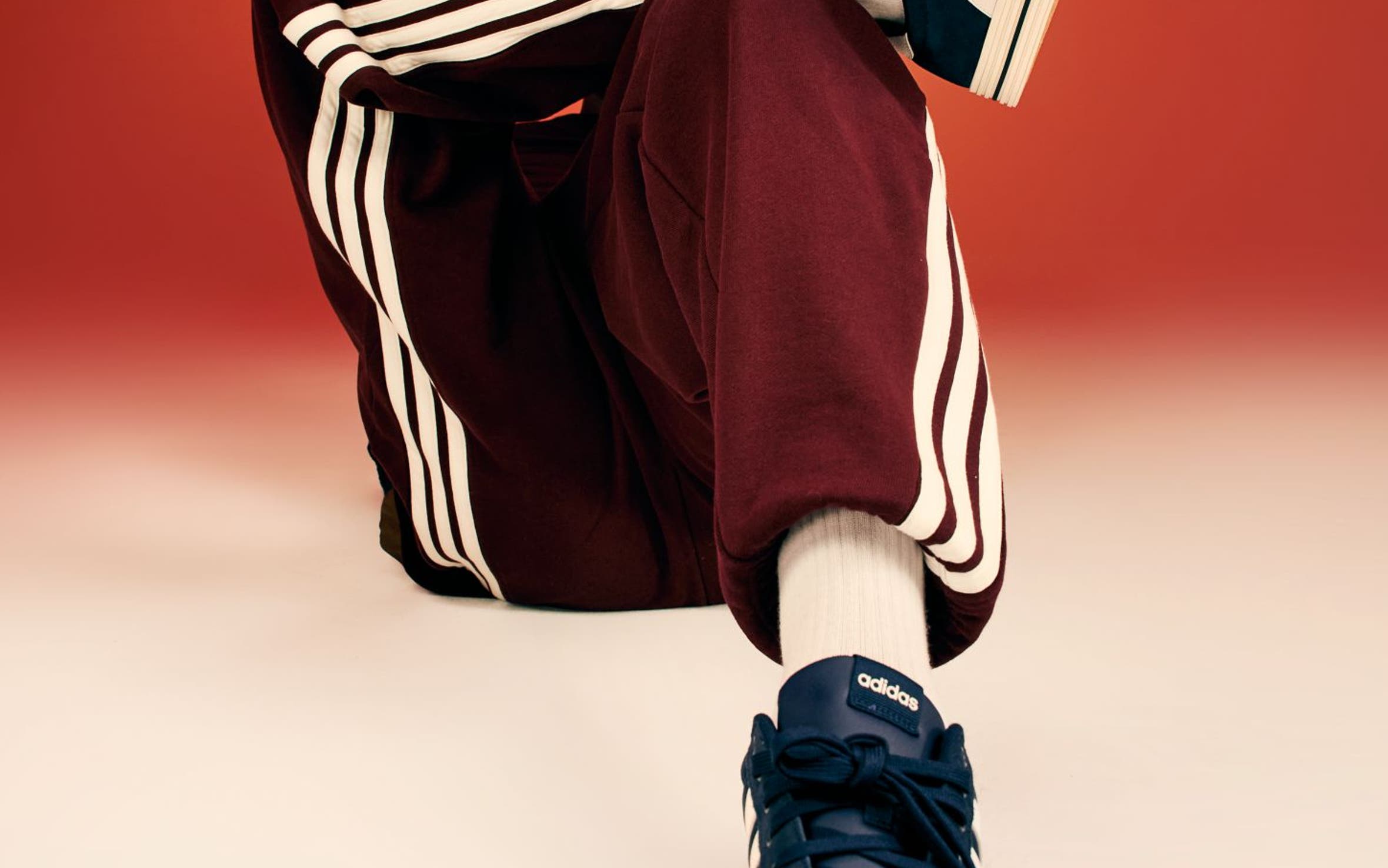 A closeup image of a person wearing blue sneakers. 