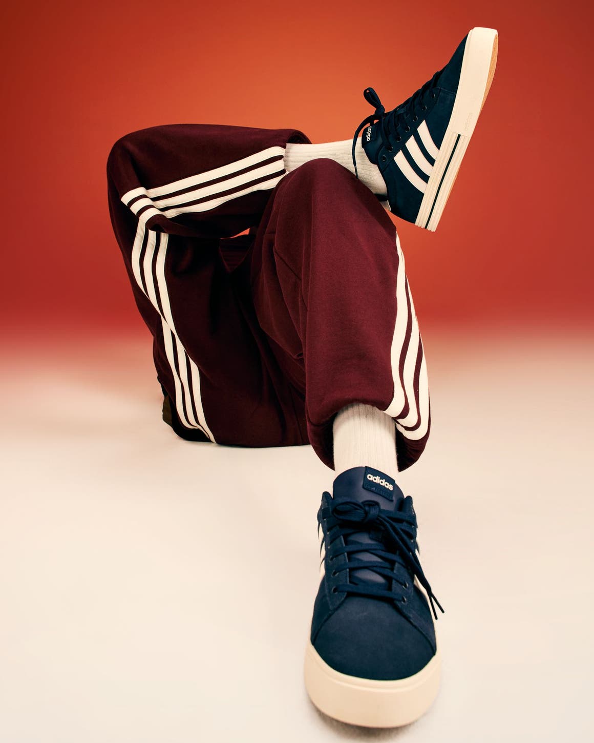 A closeup image of a person wearing blue sneakers. 