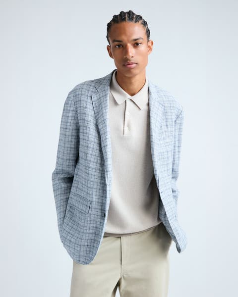Man wearing a light-blue plaid blazer.