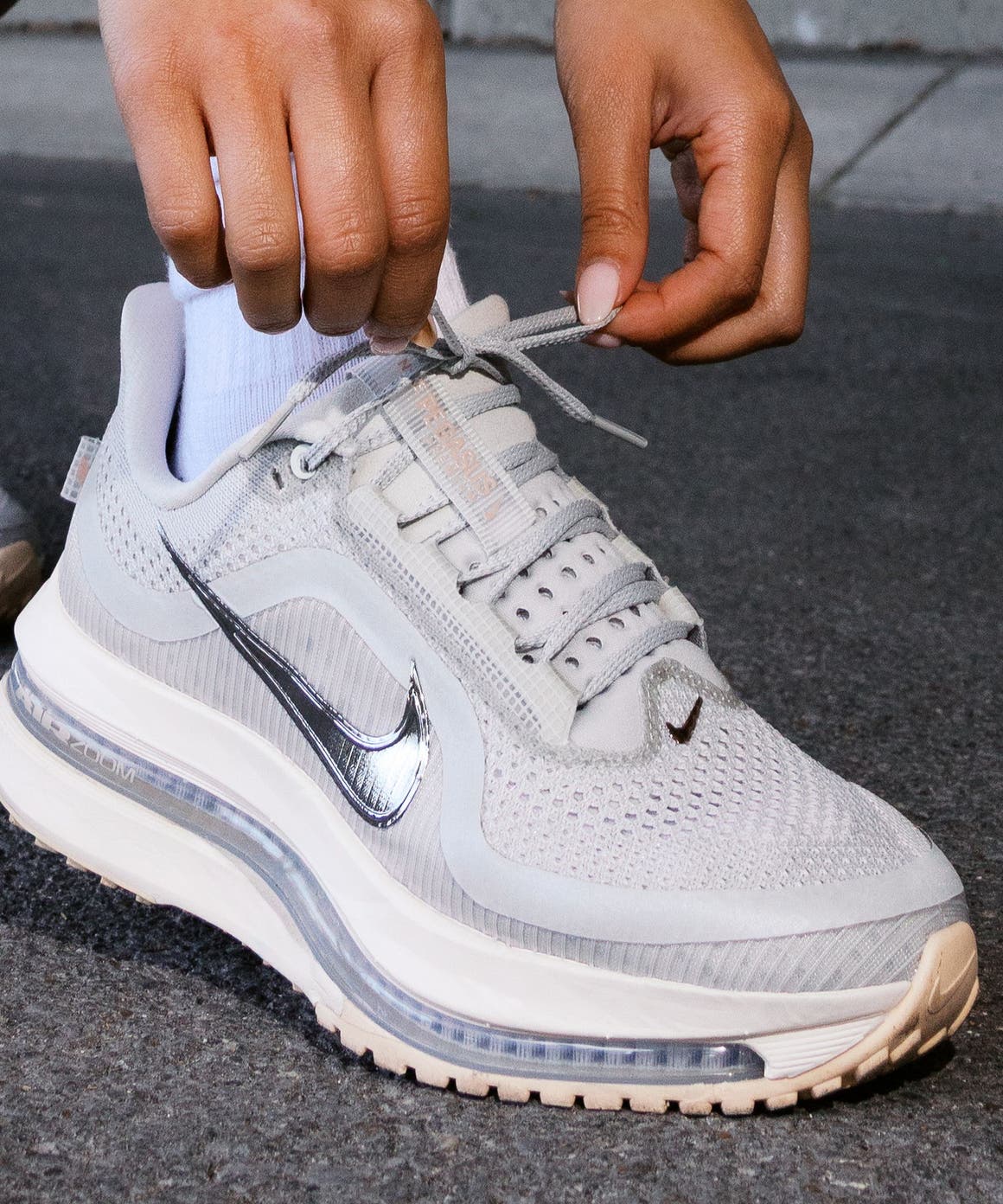 A person wearing Nike Pegasus Premium running shoes.